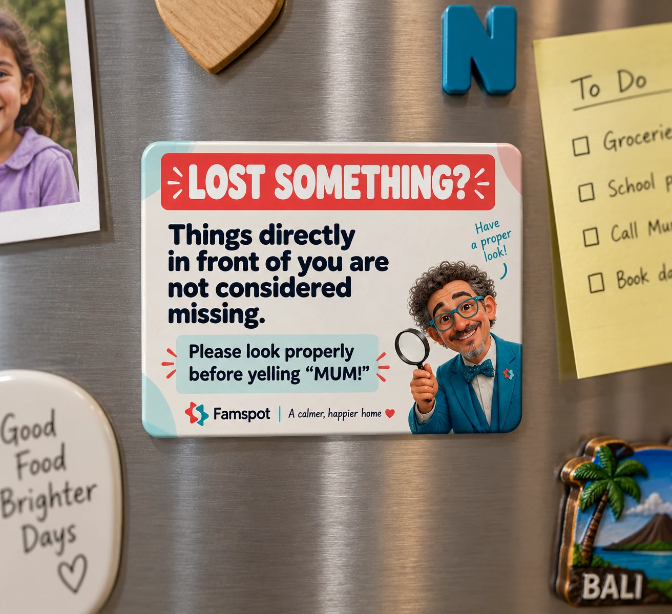 The Lost Something? magnetic notice on a family fridge beside photos, a to-do list and souvenir magnets